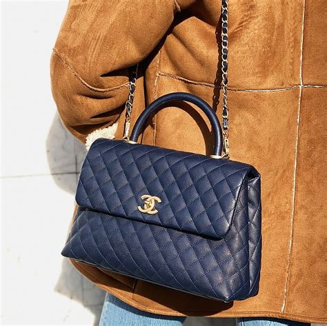 large flap bag with top handle chanel|chanel bag with gold ball.